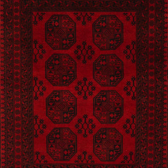 An Afghan/Pakistan carpet in red with 8 round motifs in the middle