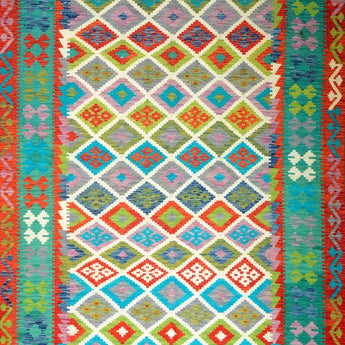 A woven kelim carpets in different colors, mainly turquoise