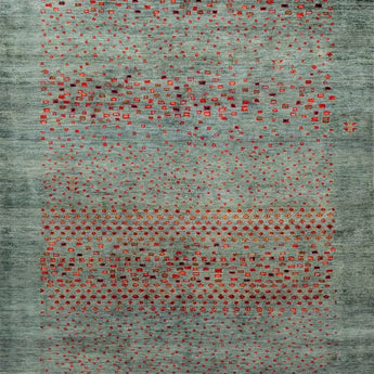 A gabbeh carpet in blue/turquoise with red dots